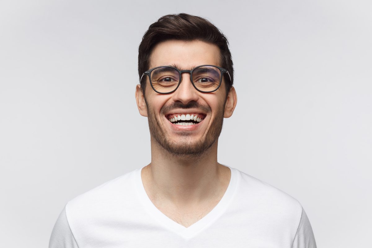 Adult orthodontics patient smiling during consultation in Lake Charles