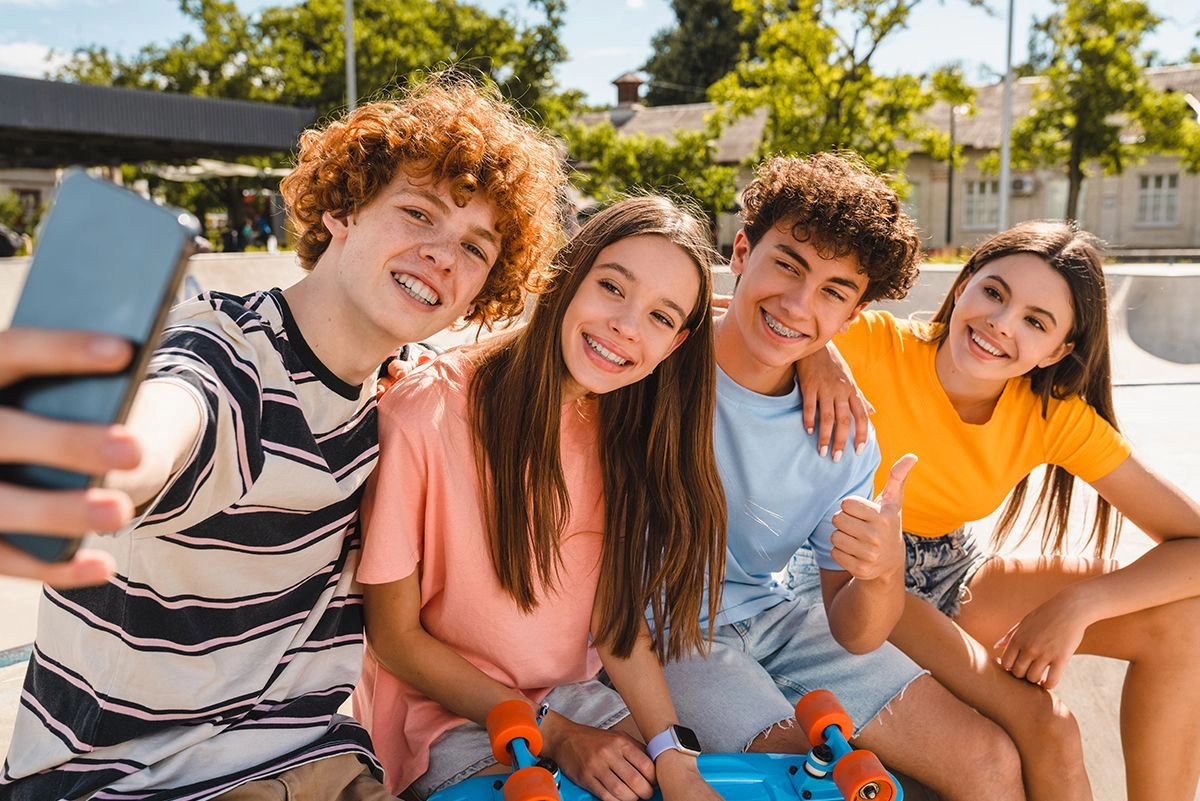 Group of teenages with warm, welcoming smiles