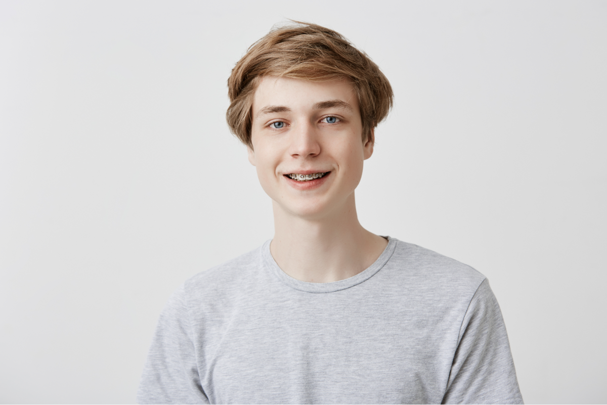 Smiling teenager with braces at Lefort Orthodontics