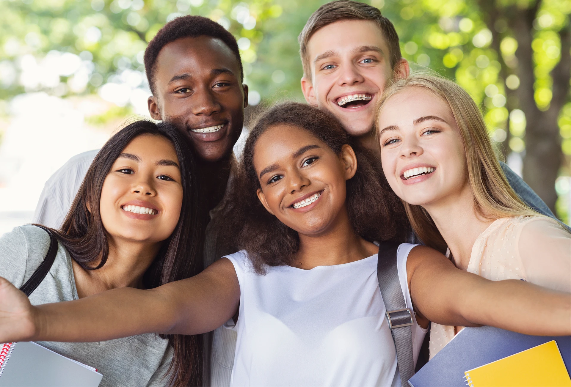 Teenagers with confident smiles after braces treatment in southwest Louisiana